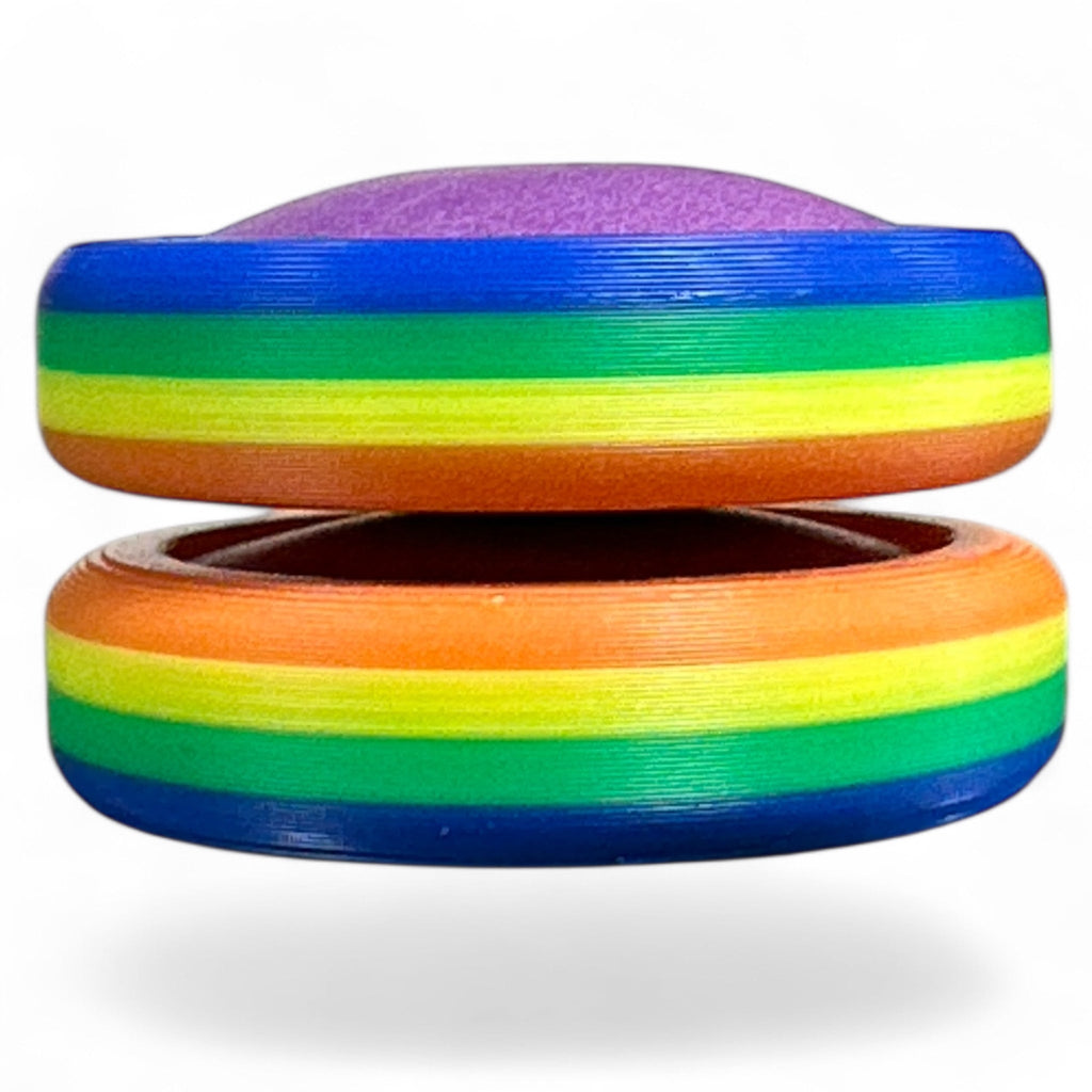 Colorful discs with rainbow stripes on a white background