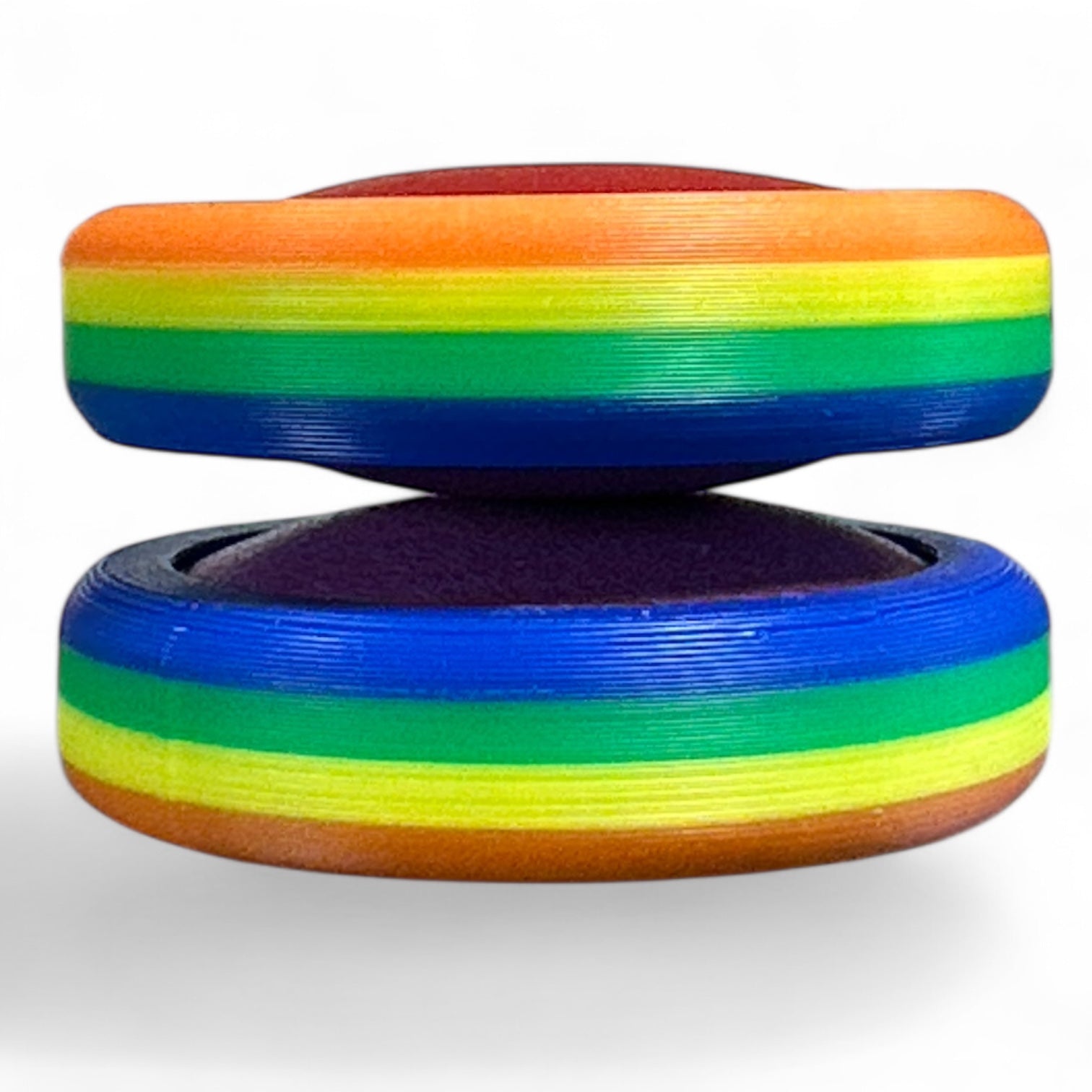 Colorful discs with rainbow pattern on a white background