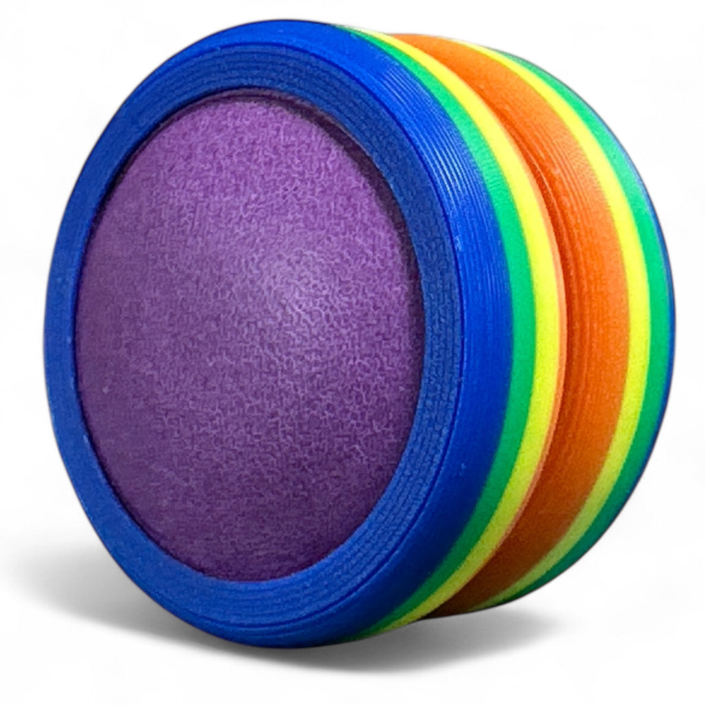 Colorful foam rings stacked on a white background