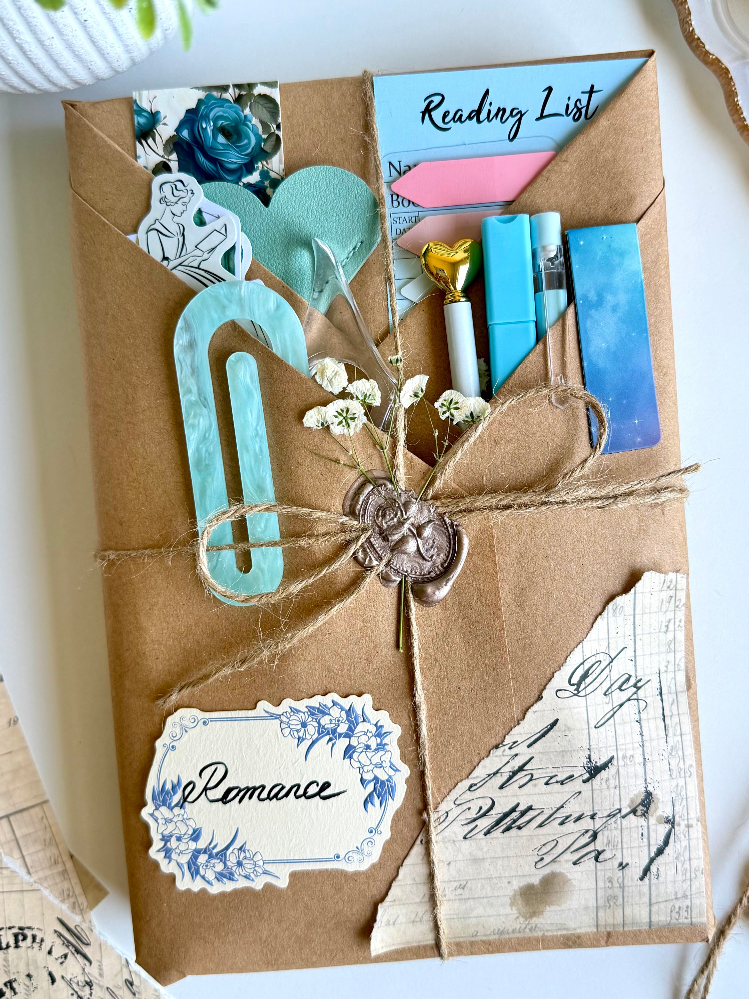 Decorative gift box with stationery items and a 'Reading List' card.