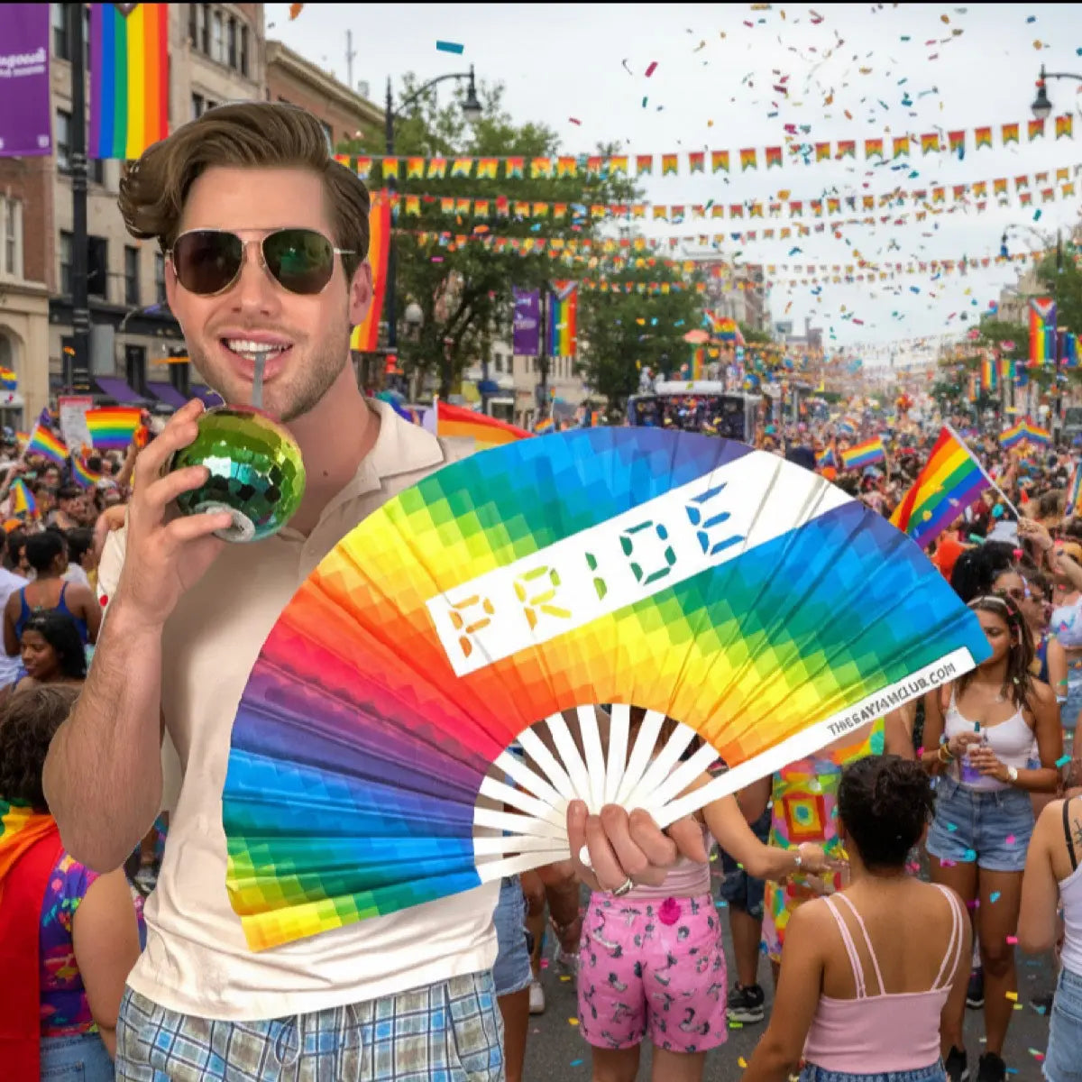 Man holding a rainbow 'PRIDE' fan at a Pride parade with confetti and flags in the background.