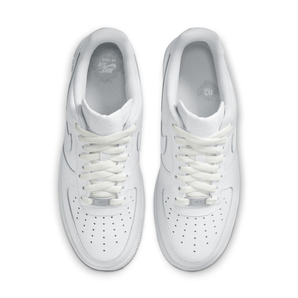 Pair of white sneakers on a white background