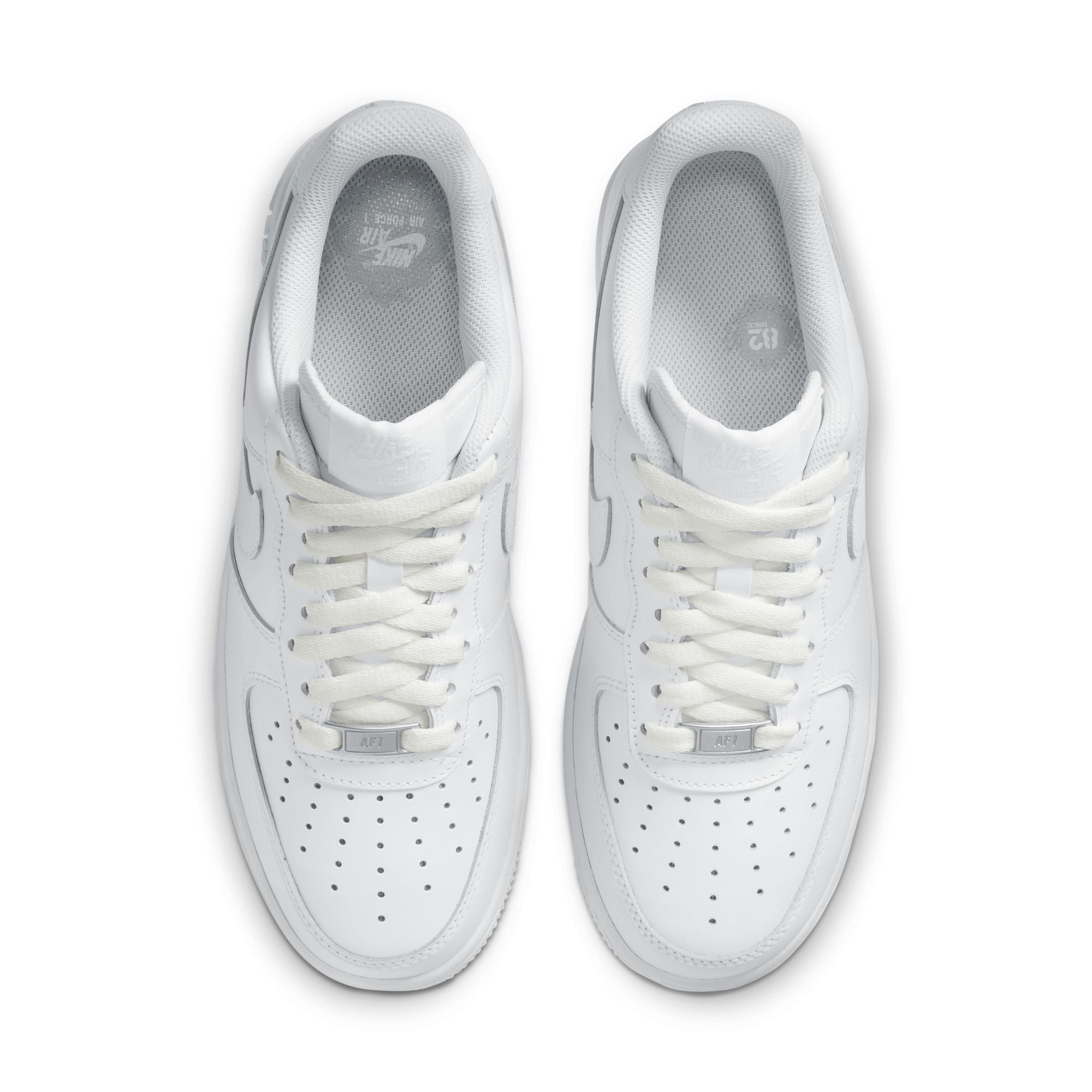 Pair of white sneakers on a white background