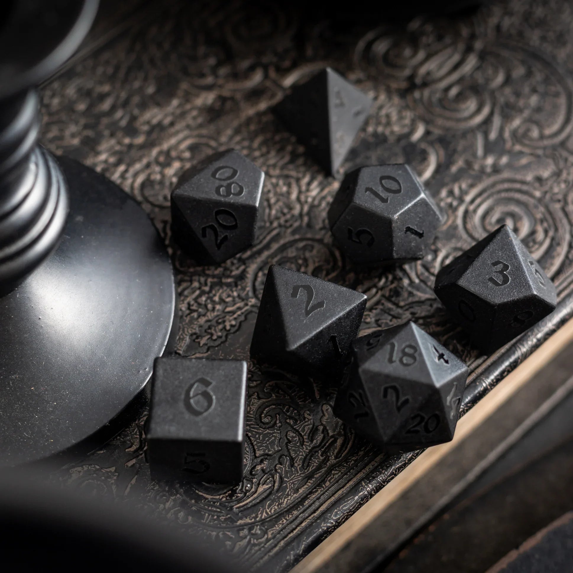 black obsidian dice with raised numbers
