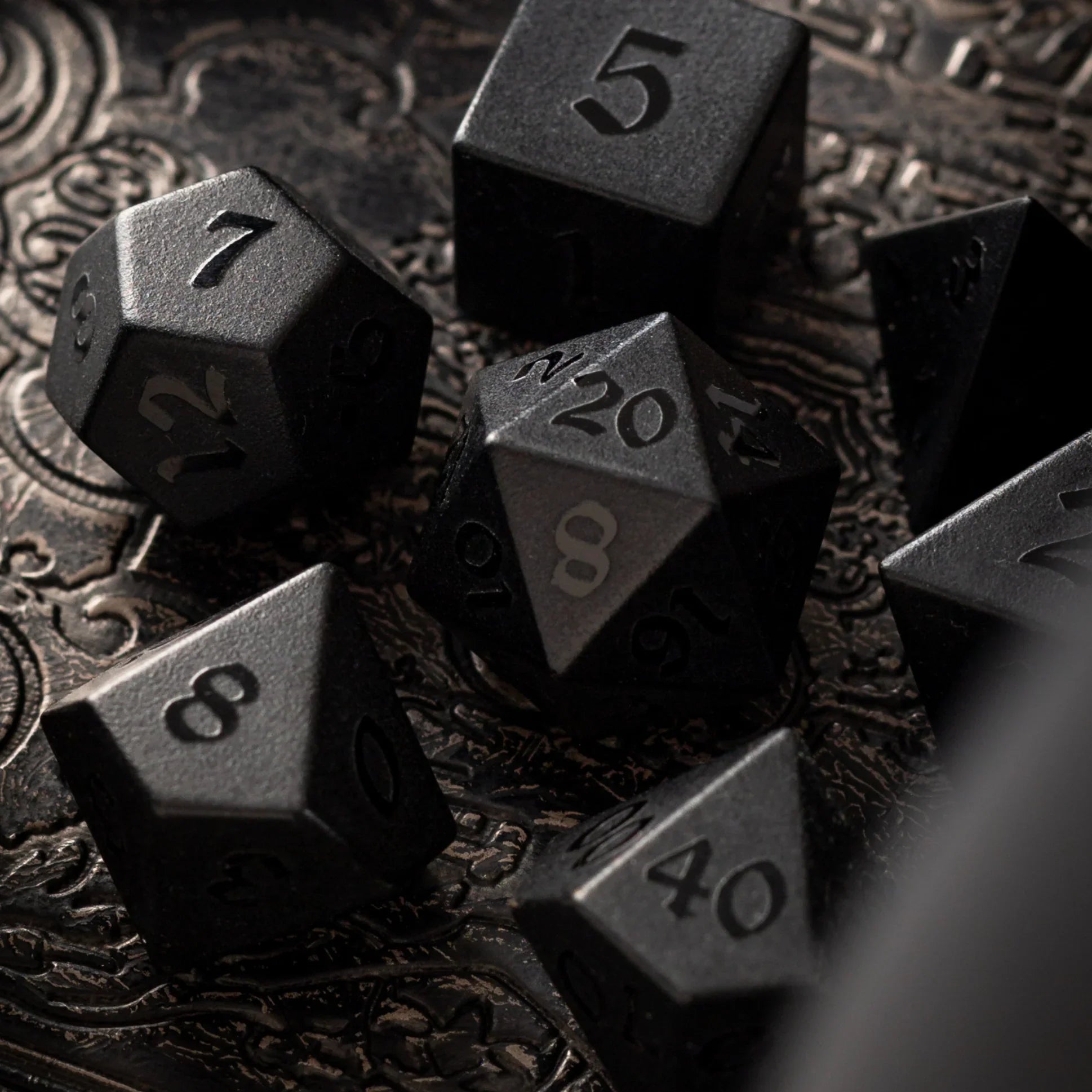 black obsidian dice with raised numbers