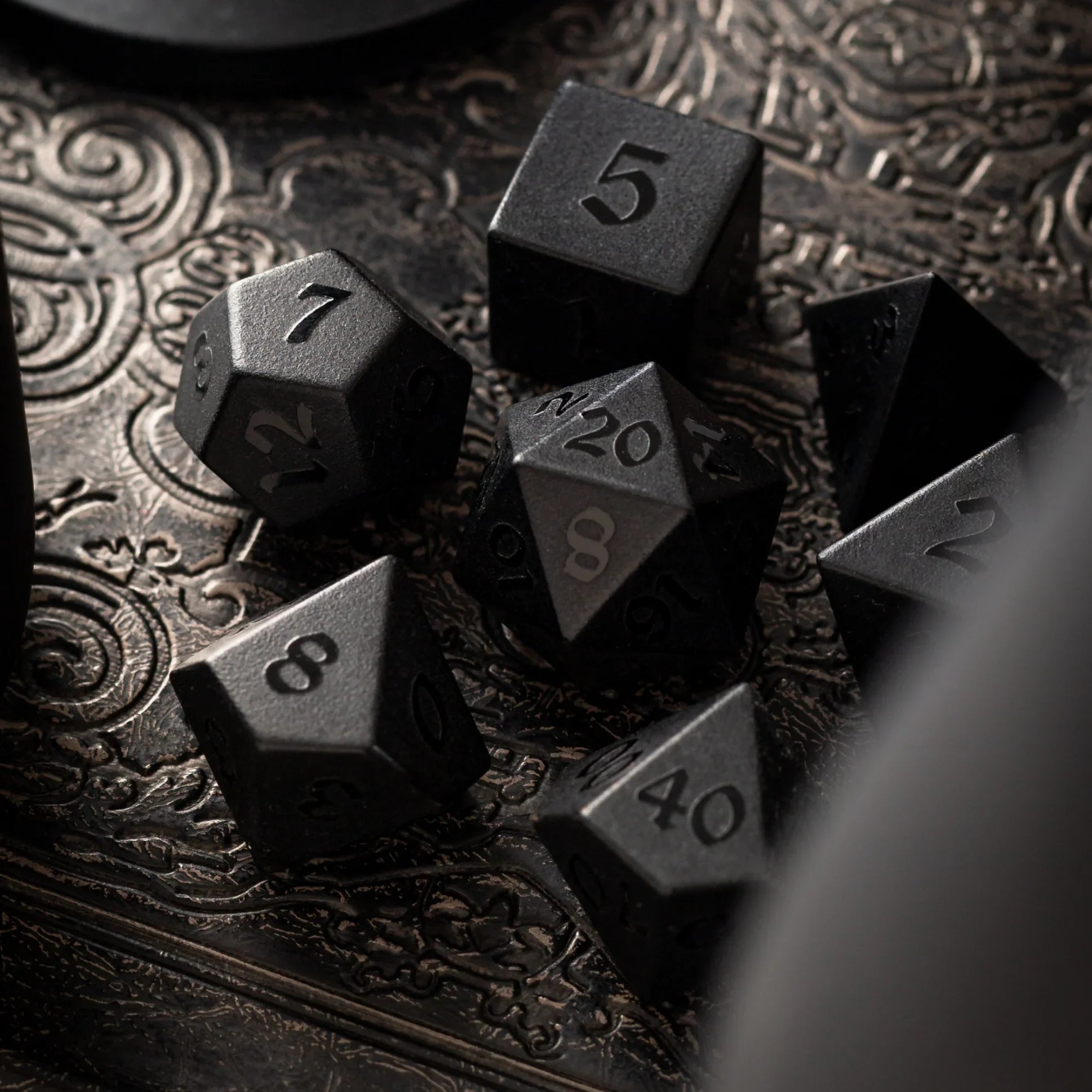black obsidian dice with raised numbers