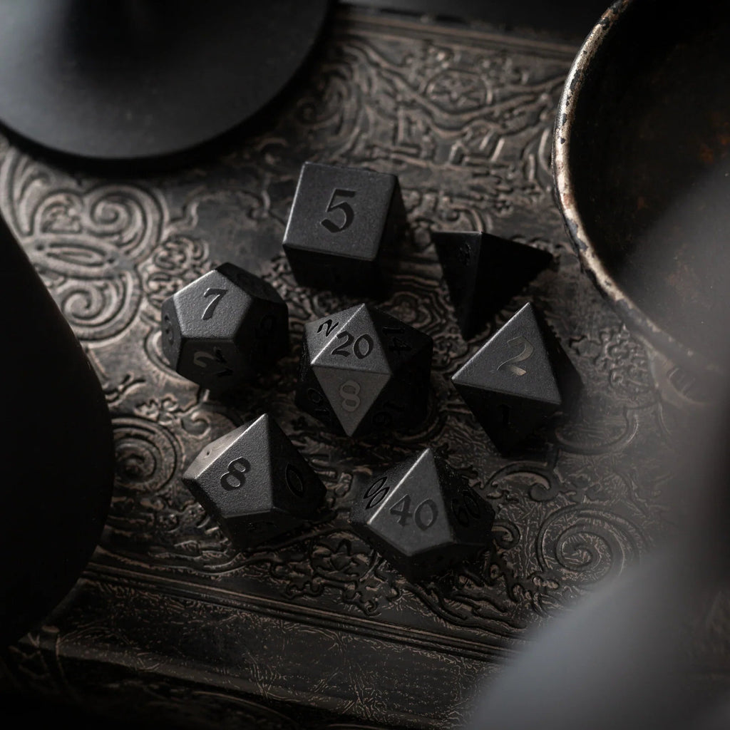 Black obsidian dice with raised numbers