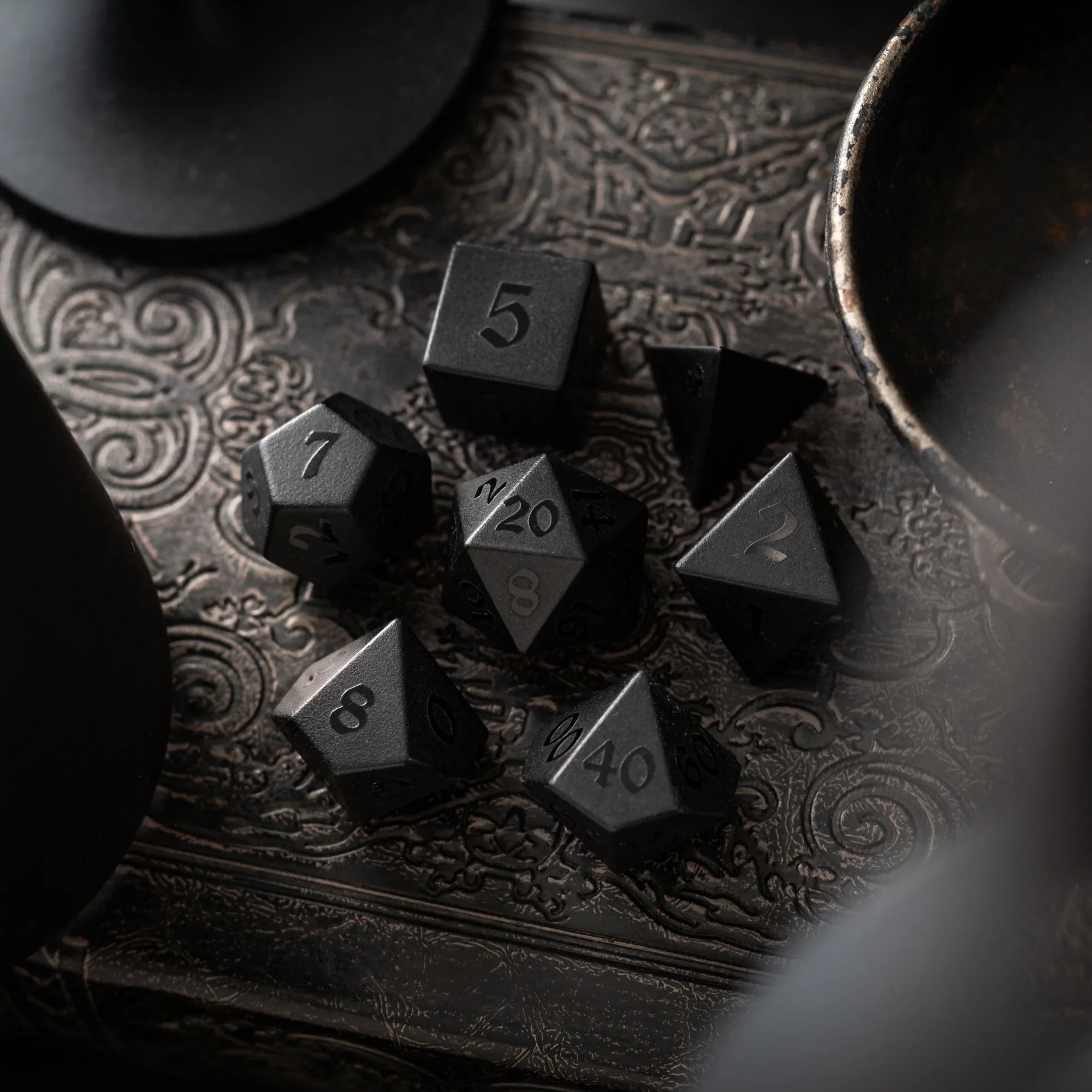 Black obsidian dice with raised numbers