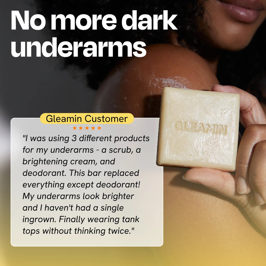 Person holding a bar of Gleamin soap with a testimonial about its effectiveness on dark underarms.