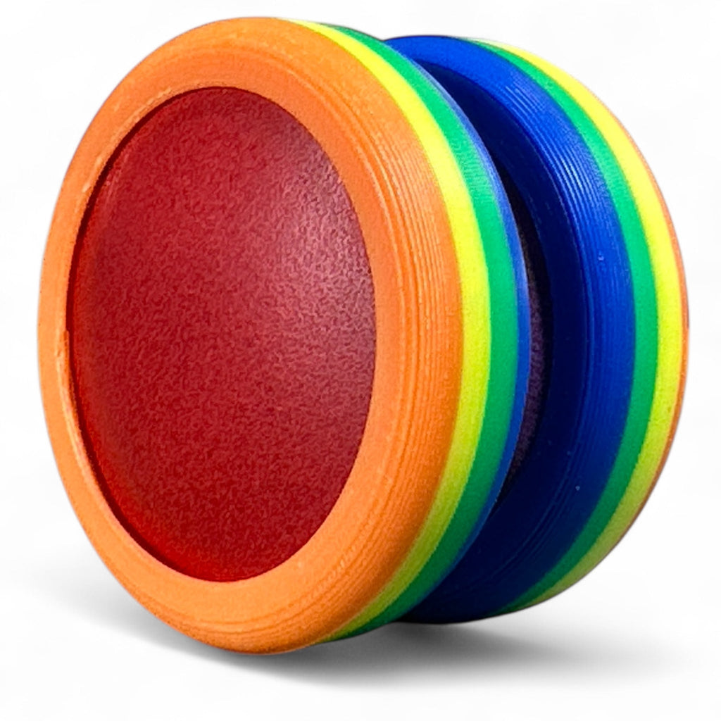 Colorful discs with red center, orange, green, and blue rings on a white background