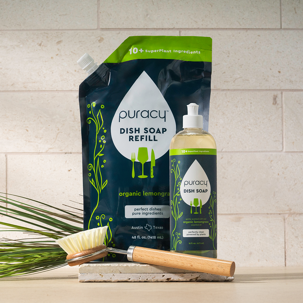 Puracy dish soap refill pack and bottle on a light stone background
