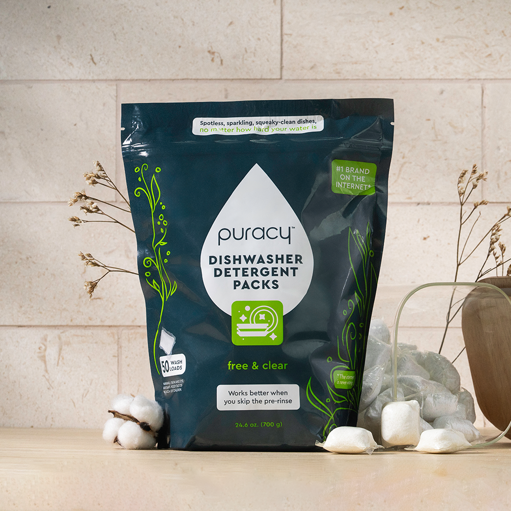Puracy dishwasher detergent packs on a neutral background