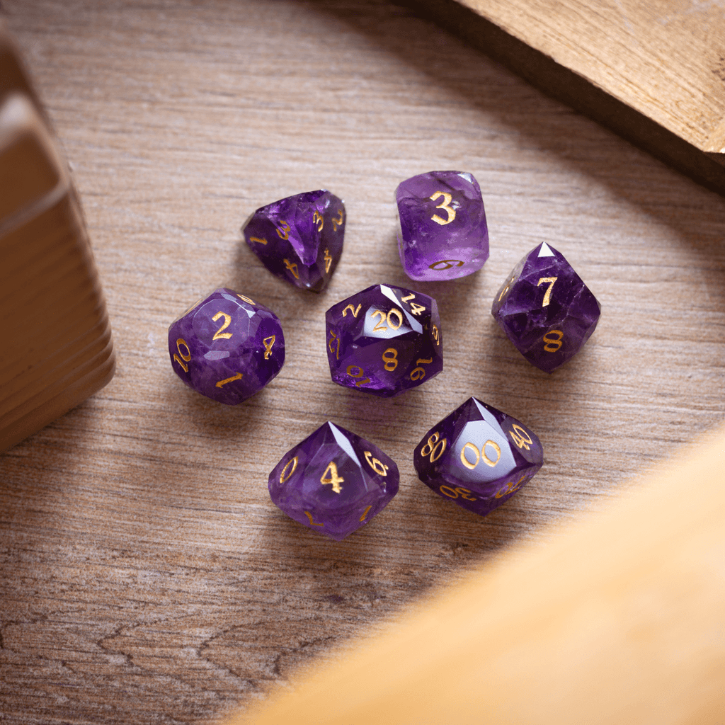 Purple polyhedral dice set on a wooden surface