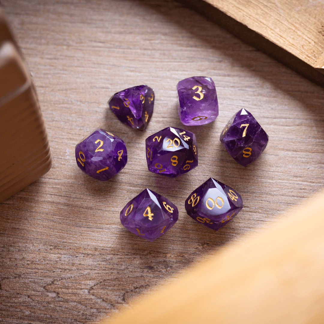 Purple polyhedral dice set on a wooden surface