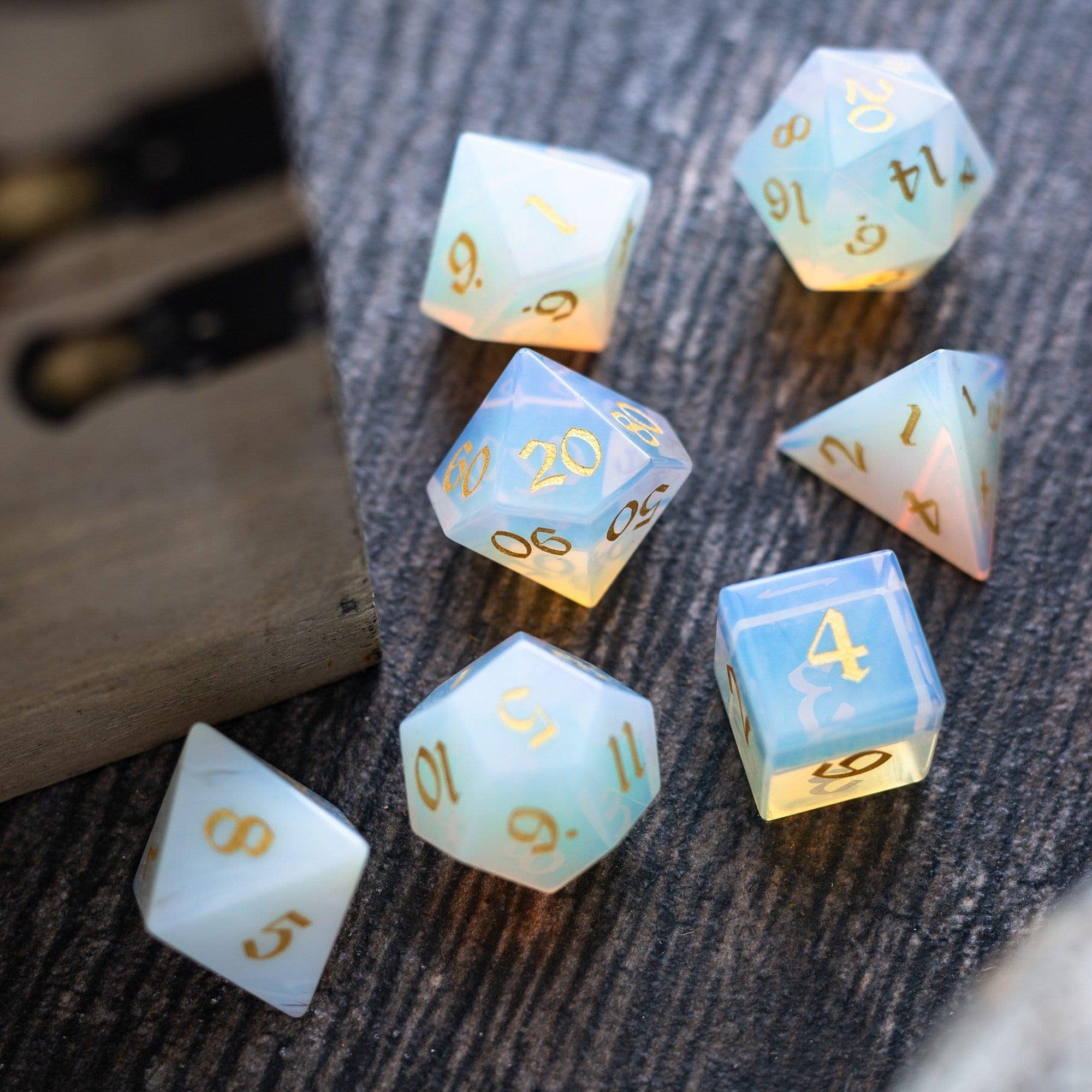 Set of glowing polyhedral dice on a textured surface