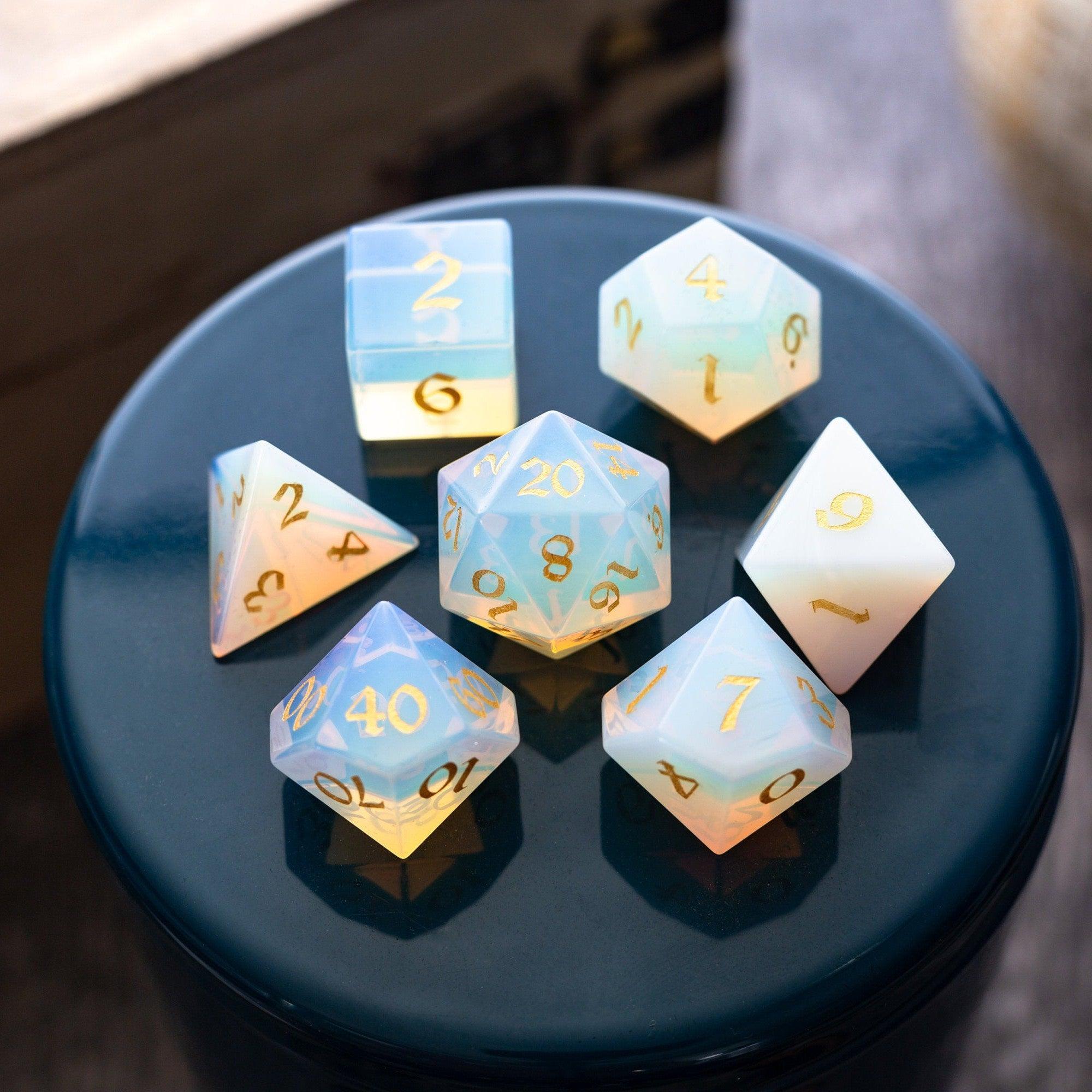 Set of colorful polyhedral dice on a reflective surface