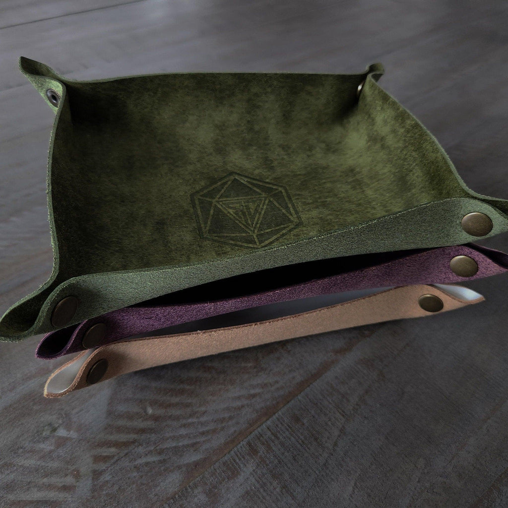 green and purple and tan leather dice roll box stacked