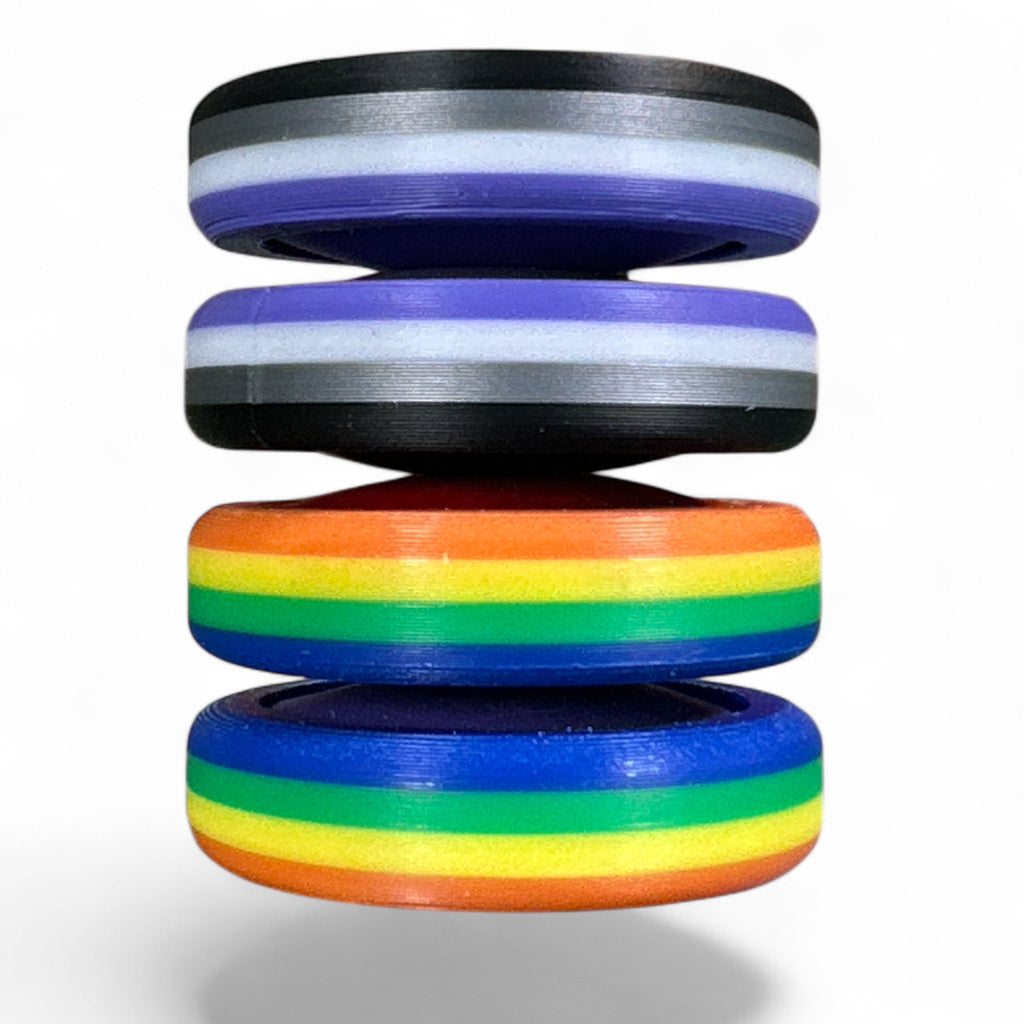 Stack of colorful rings with a rainbow design on a white background