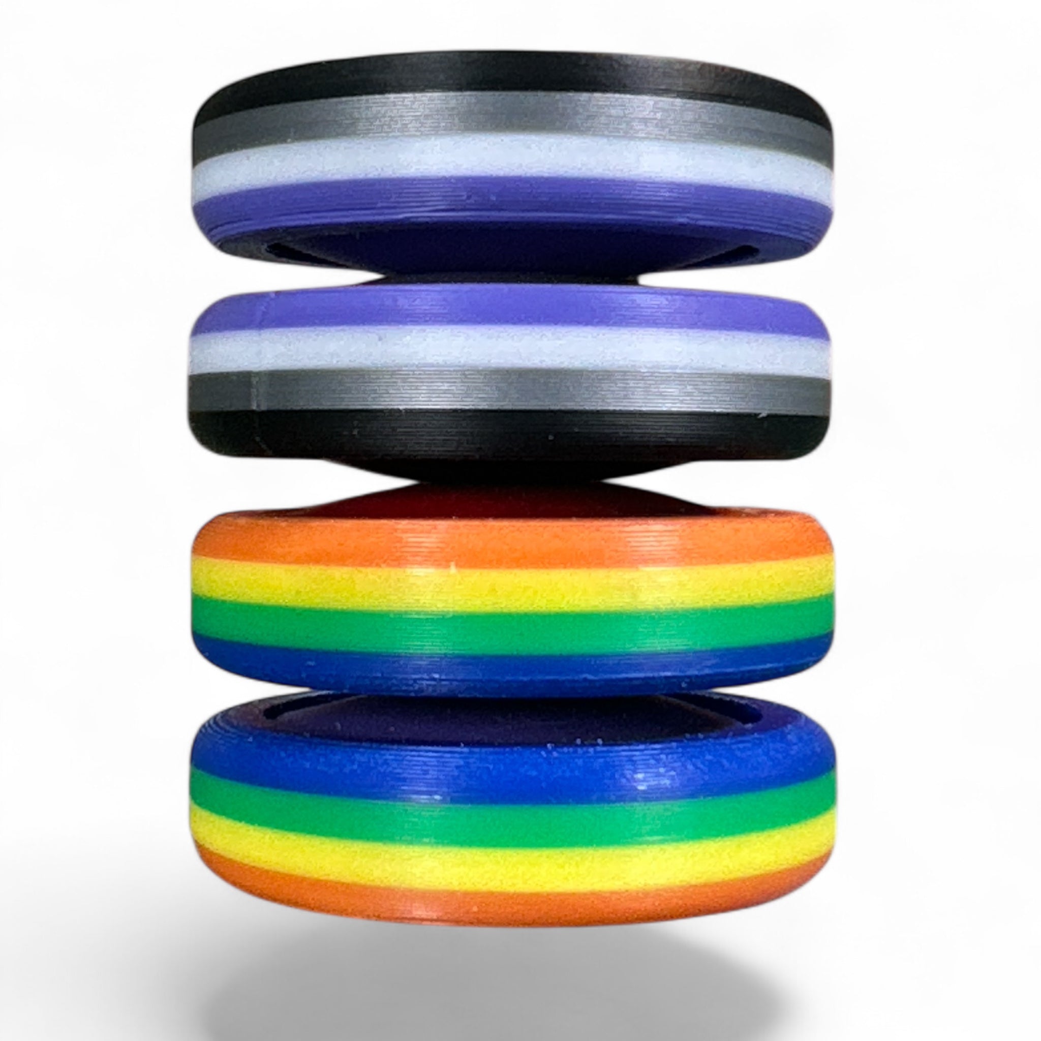 Stack of colorful rings with a rainbow design on a white background