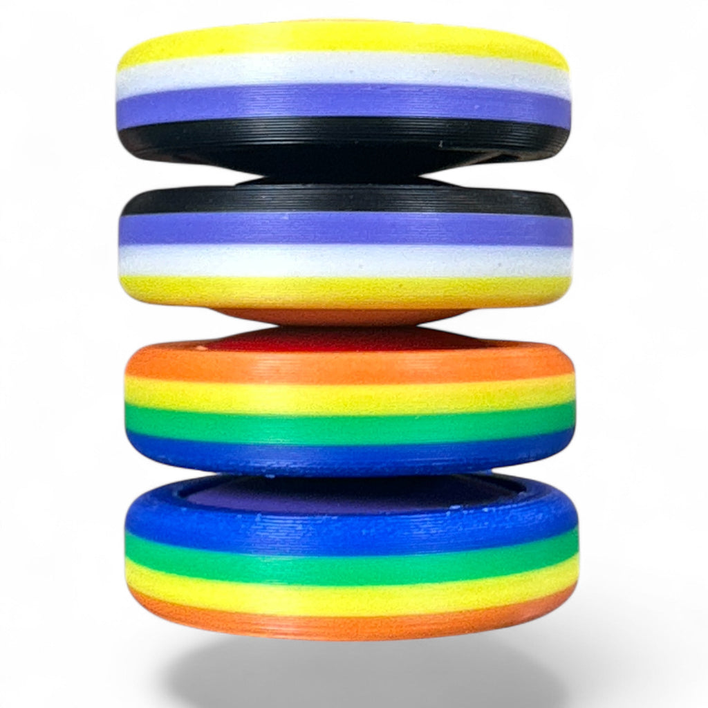 Stack of colorful discs with rainbow pattern on a white background