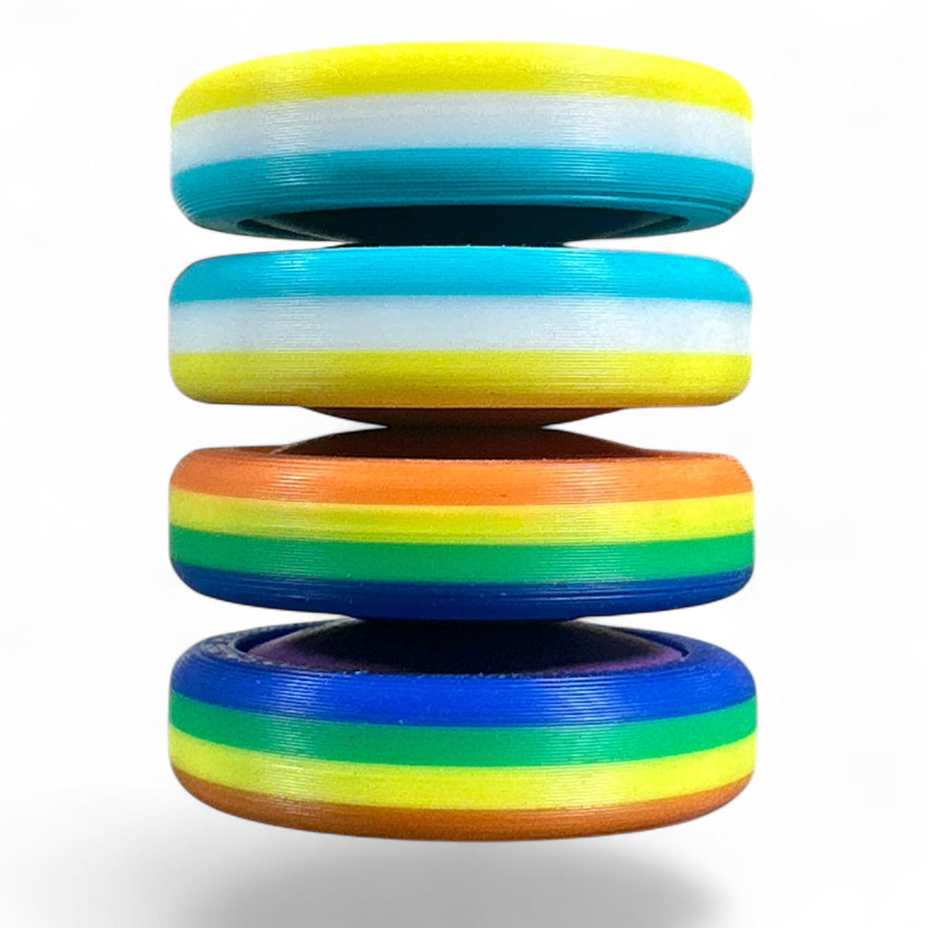 Stack of colorful rings with rainbow pattern on a white background