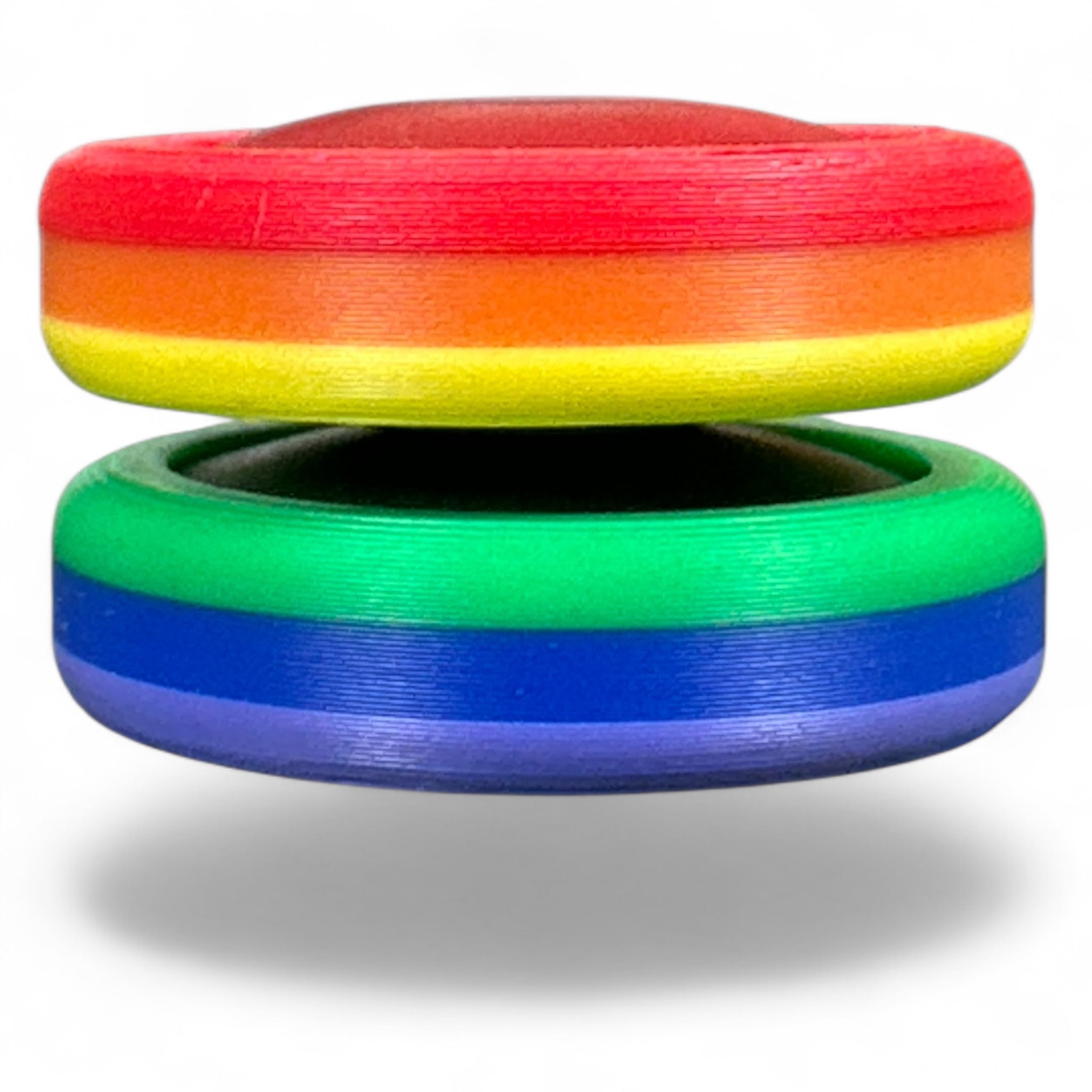 Two colorful rings, one red, orange, yellow, green, and blue, on a white background.