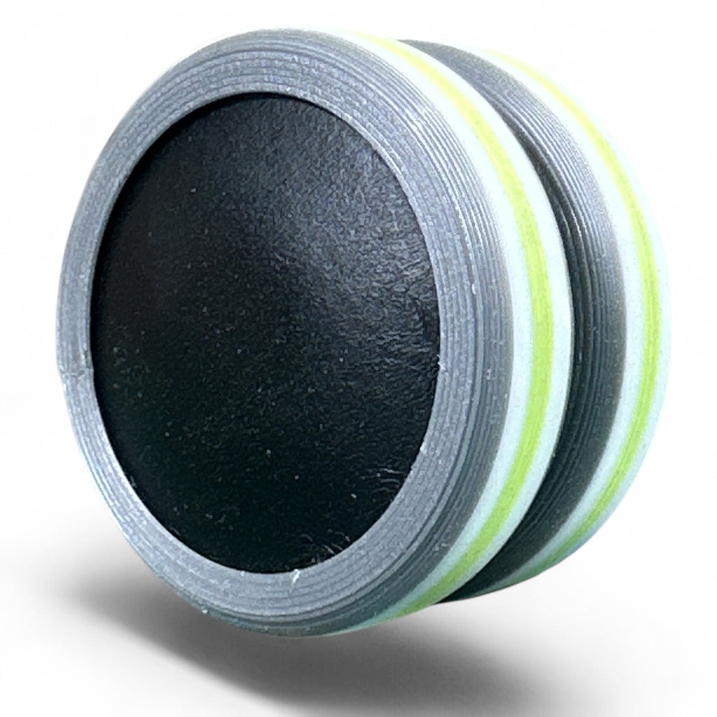 Black disc with a white border on a white background