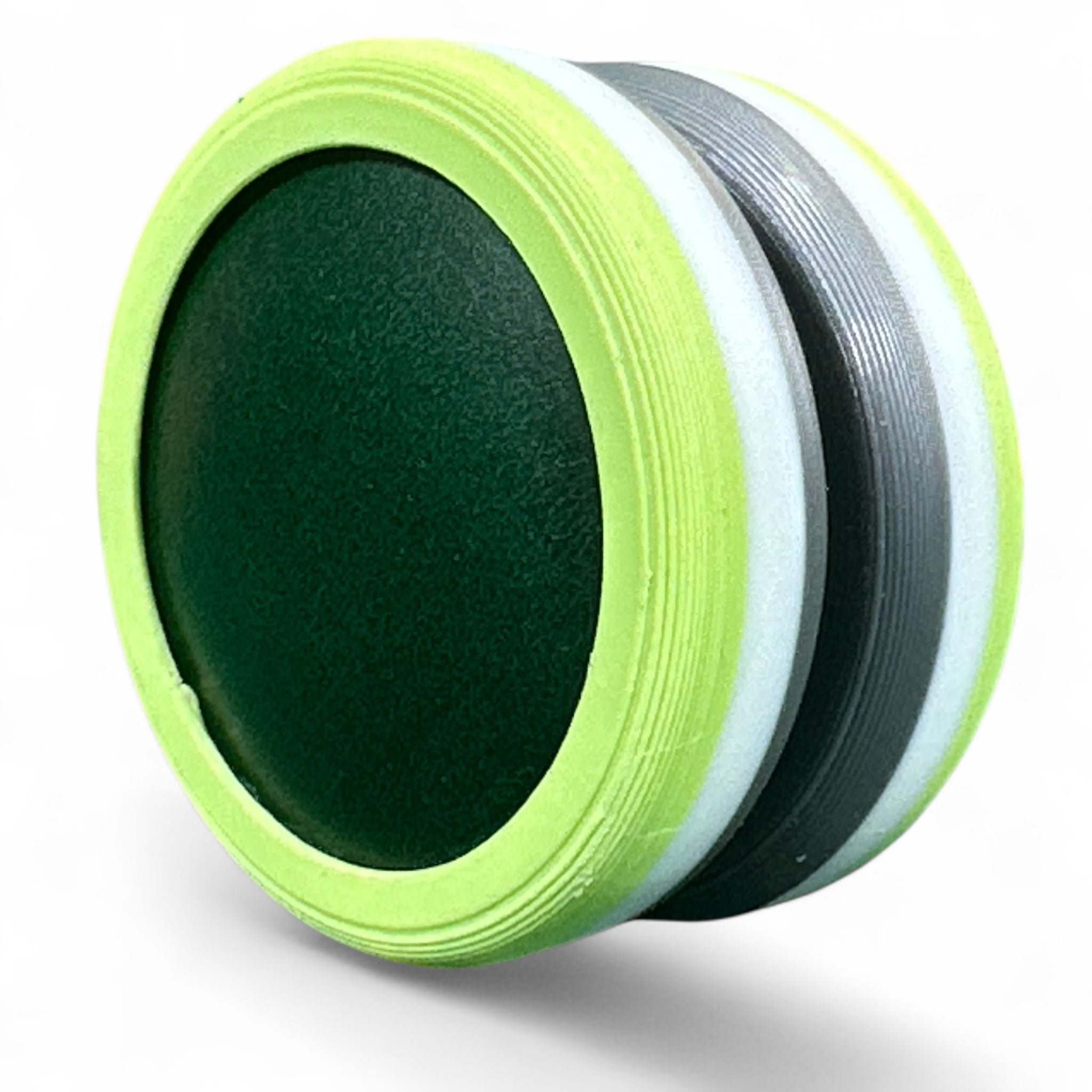 Close-up of a green and black discs on a white background