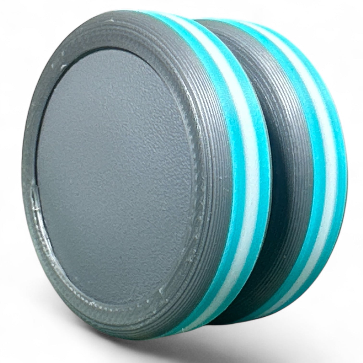 Gray and turquoise discs on a white background