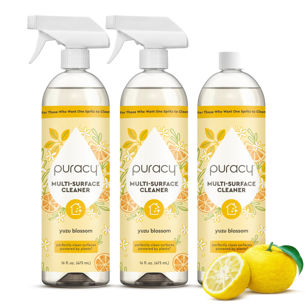 Three bottles of Puracy Multi-Surface Cleaner with yuzu blossom scent on a white background.