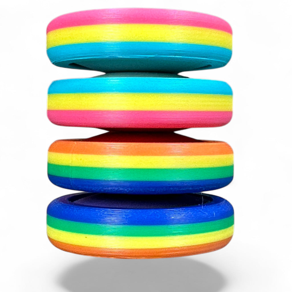 Stack of colorful rings with rainbow pattern on a white background
