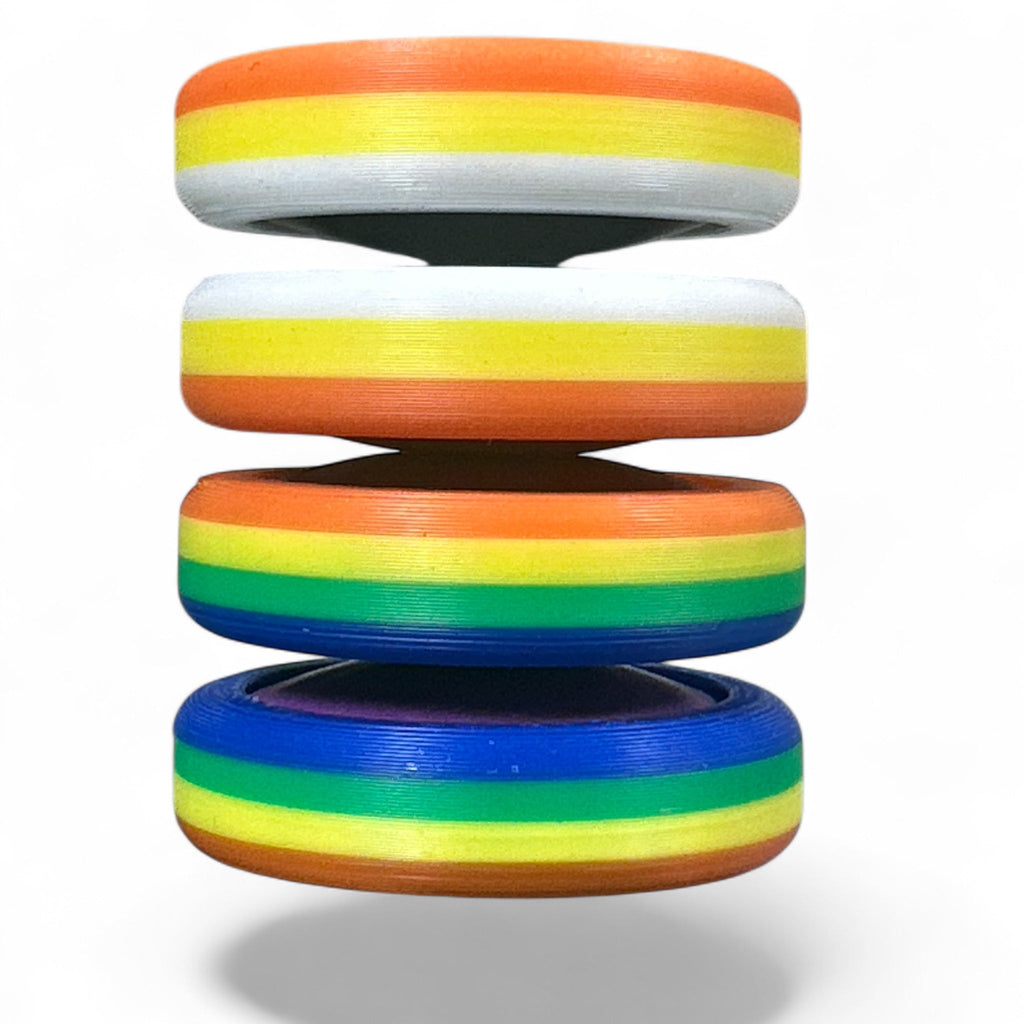 Stack of rainbow-colored rings on a white background