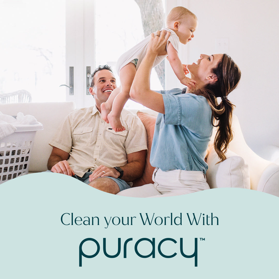 Family with a baby in a living room, promoting Puracy cleaning products.