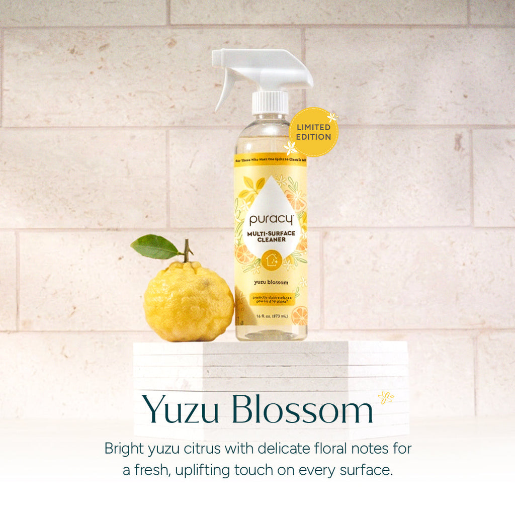Puracy Multi-Surface Cleaner bottle with yuzu fruit on a tiled background