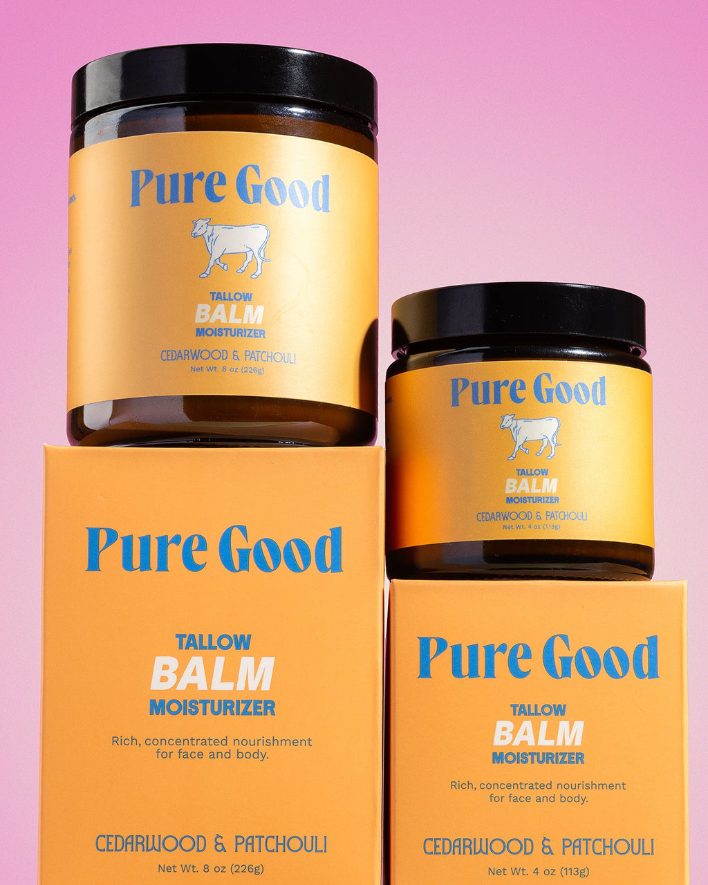 Two jars of Pure Good tallow balm on a pink background