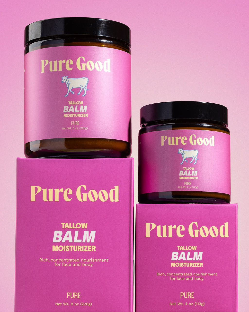 Two jars of Pure Good tallow balm on a pink background