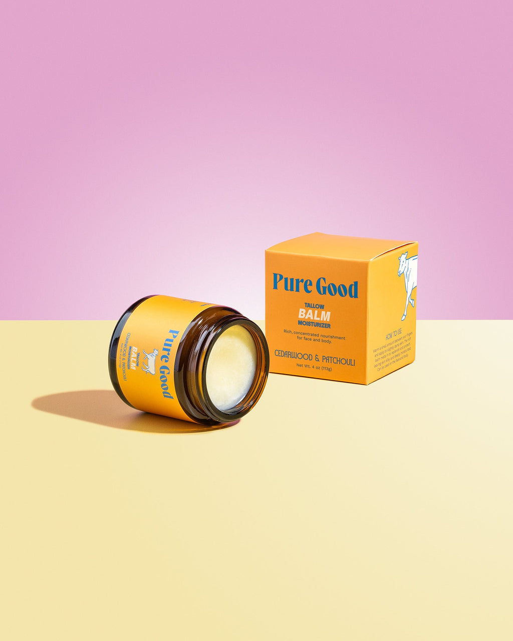 Jar and box of 'Pure Good' balm on a pink and yellow gradient background