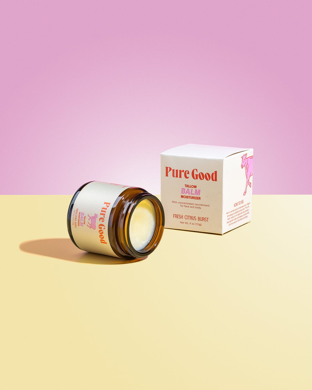 Jar of Pure Good skincare product on a pink and yellow gradient background