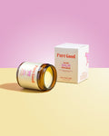 Tallow balm with 'Pure Good' branding on a pink and yellow gradient background