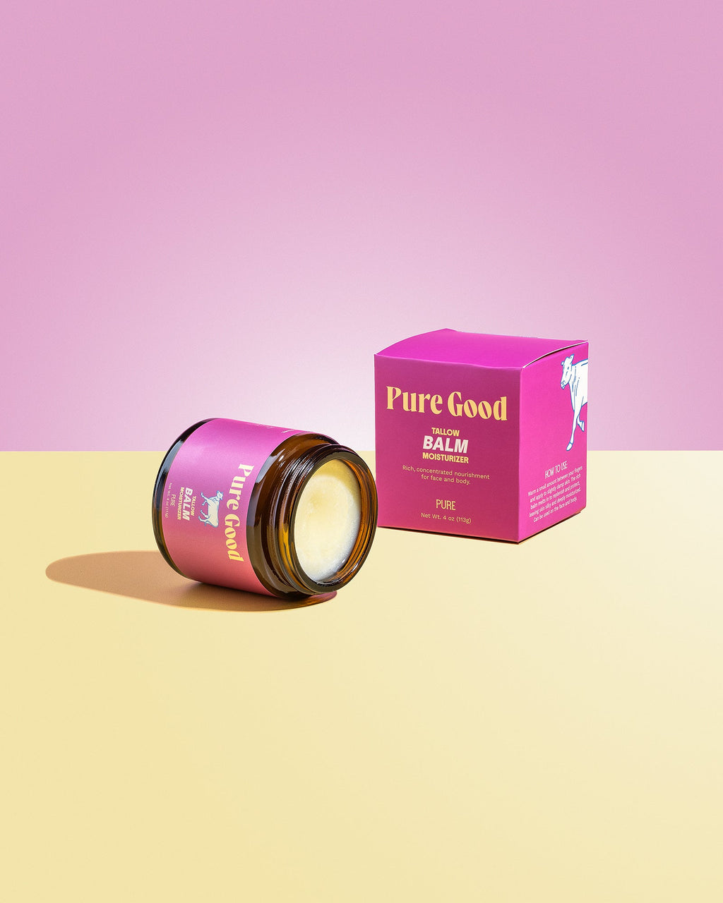 Pink 'Pure Good' balm jar and box on a pink and yellow gradient background