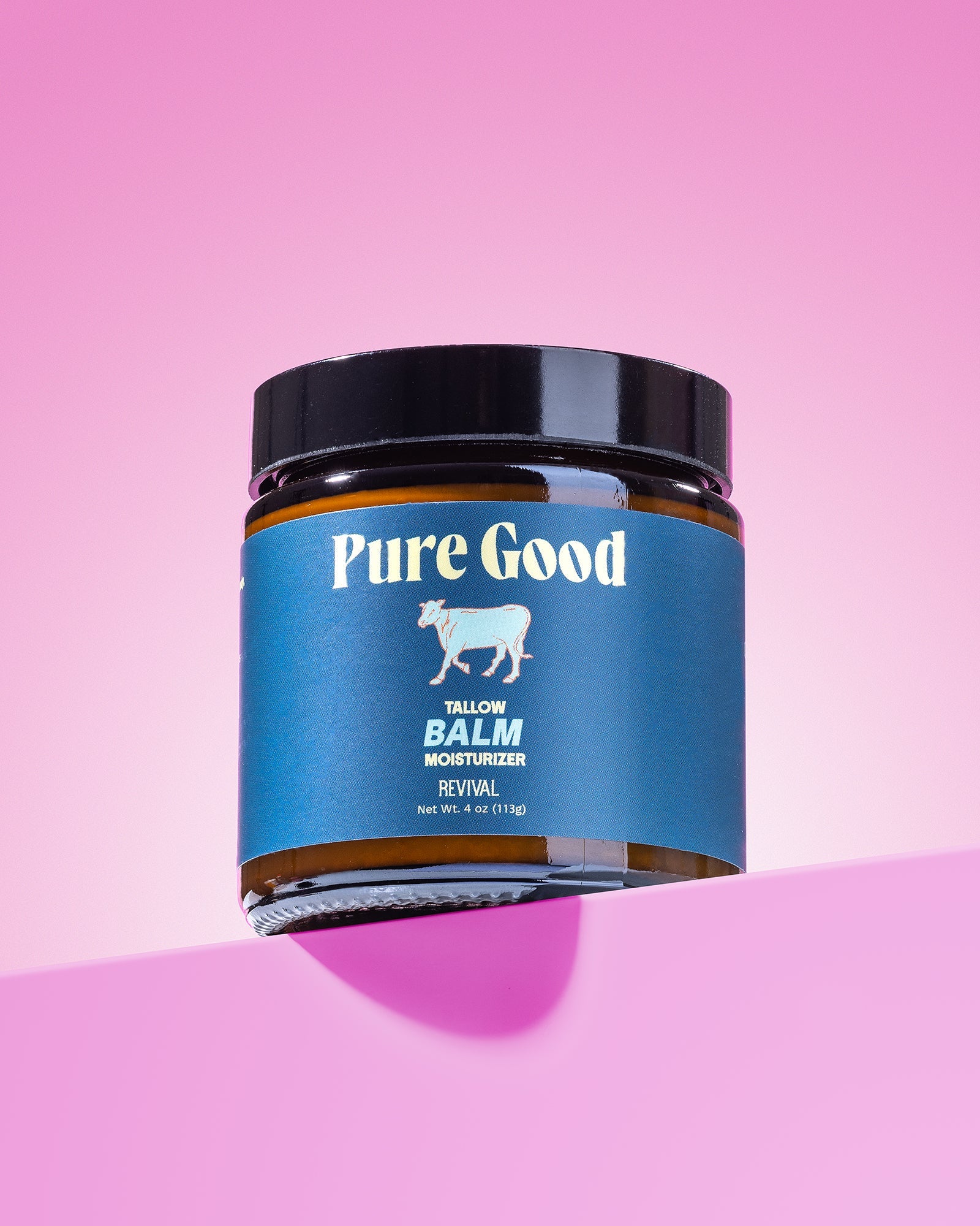 Jar of 'Pure Good' balm on a pink background