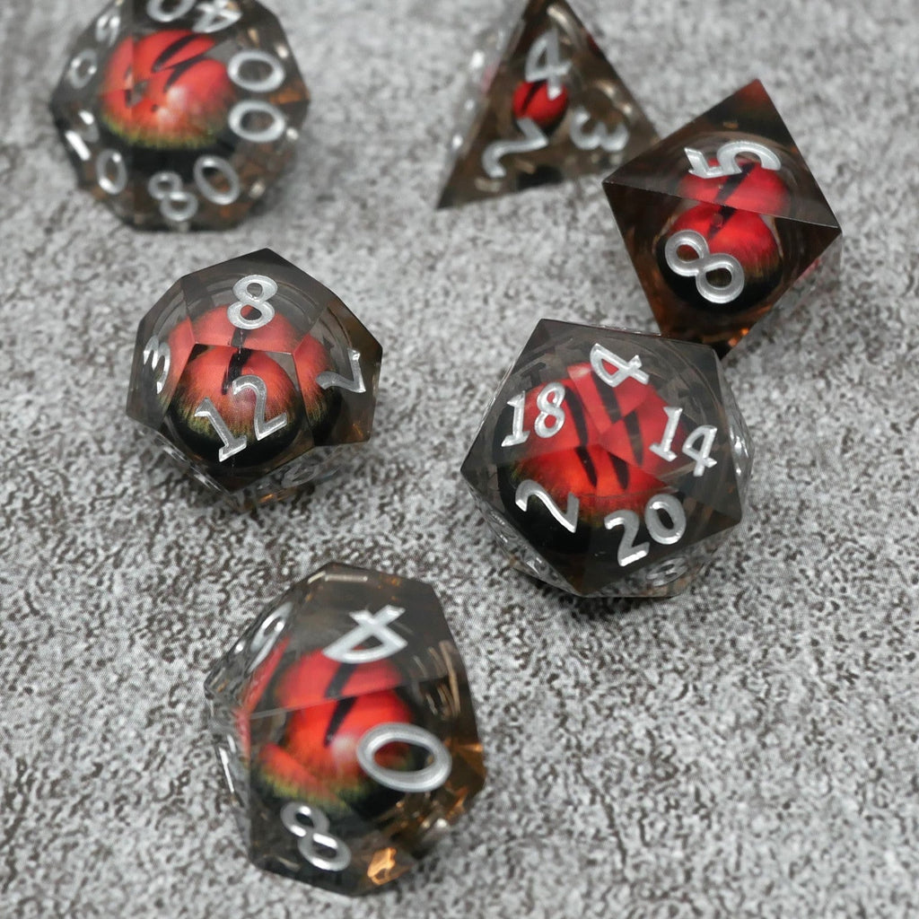 Set of polyhedral dice with red and black design on a gray textured background