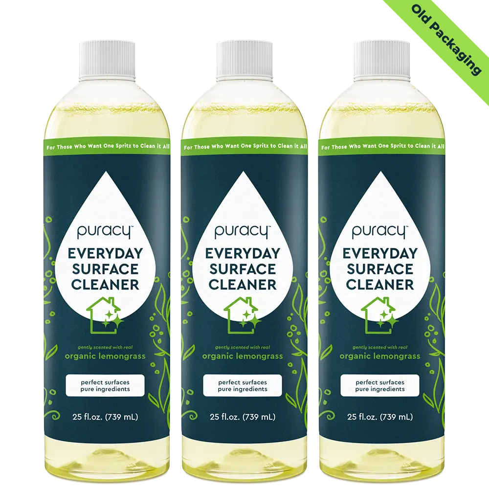 Three bottles of Puracy Everyday Surface Cleaner with old packaging label.