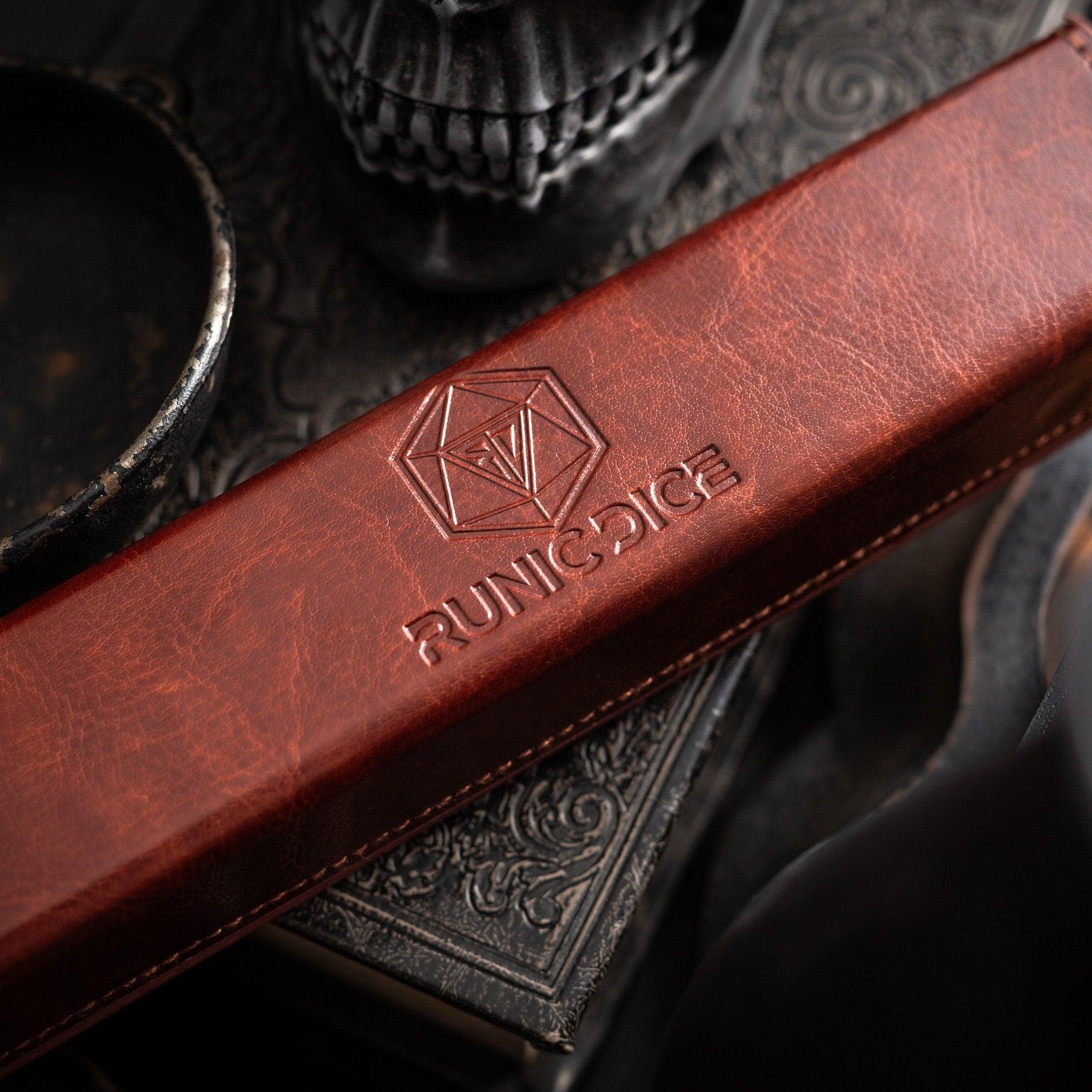 Brown leather strap with 'Runic Dice' logo on a dark background