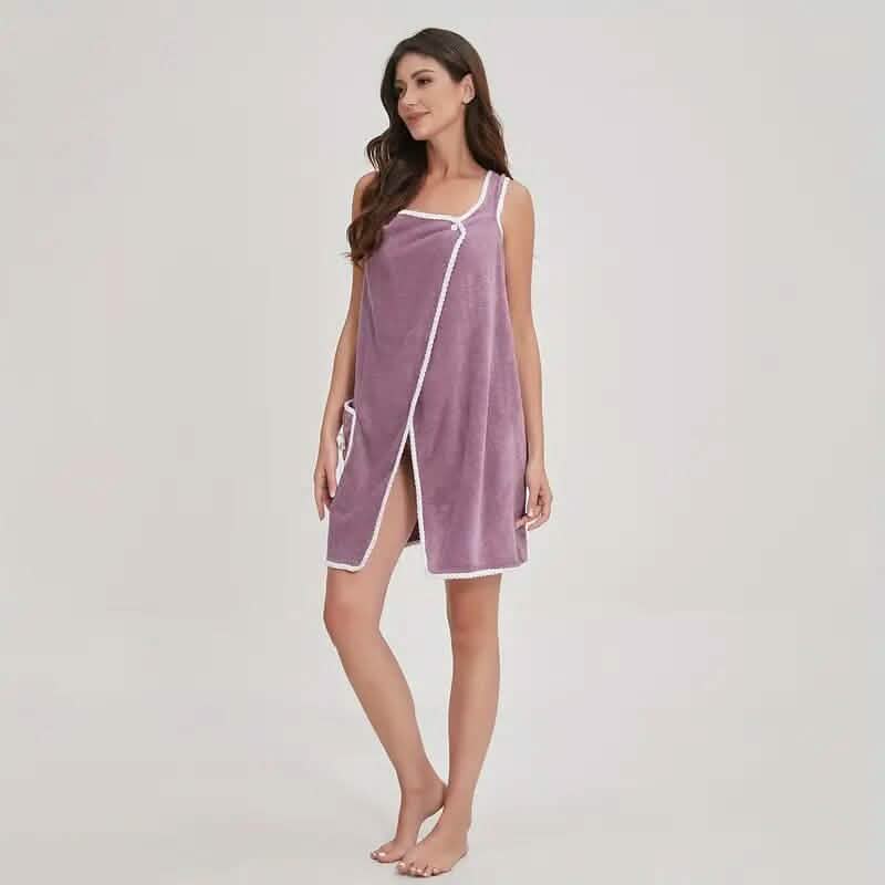 Woman wearing a purple sleeveless dress with white trim on a plain background