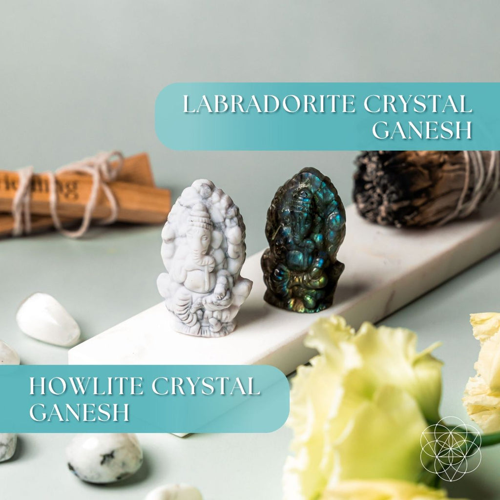 Two crystal Ganesh statues, one labradorite and one howlite, on a light surface with text labels.