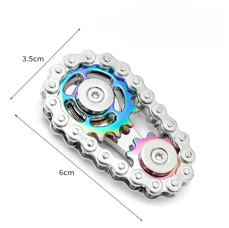 Metallic fidget spinner with rainbow color scheme and measurements on a white background