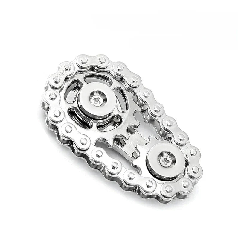 silver and silver chain fidget spinner on a white background