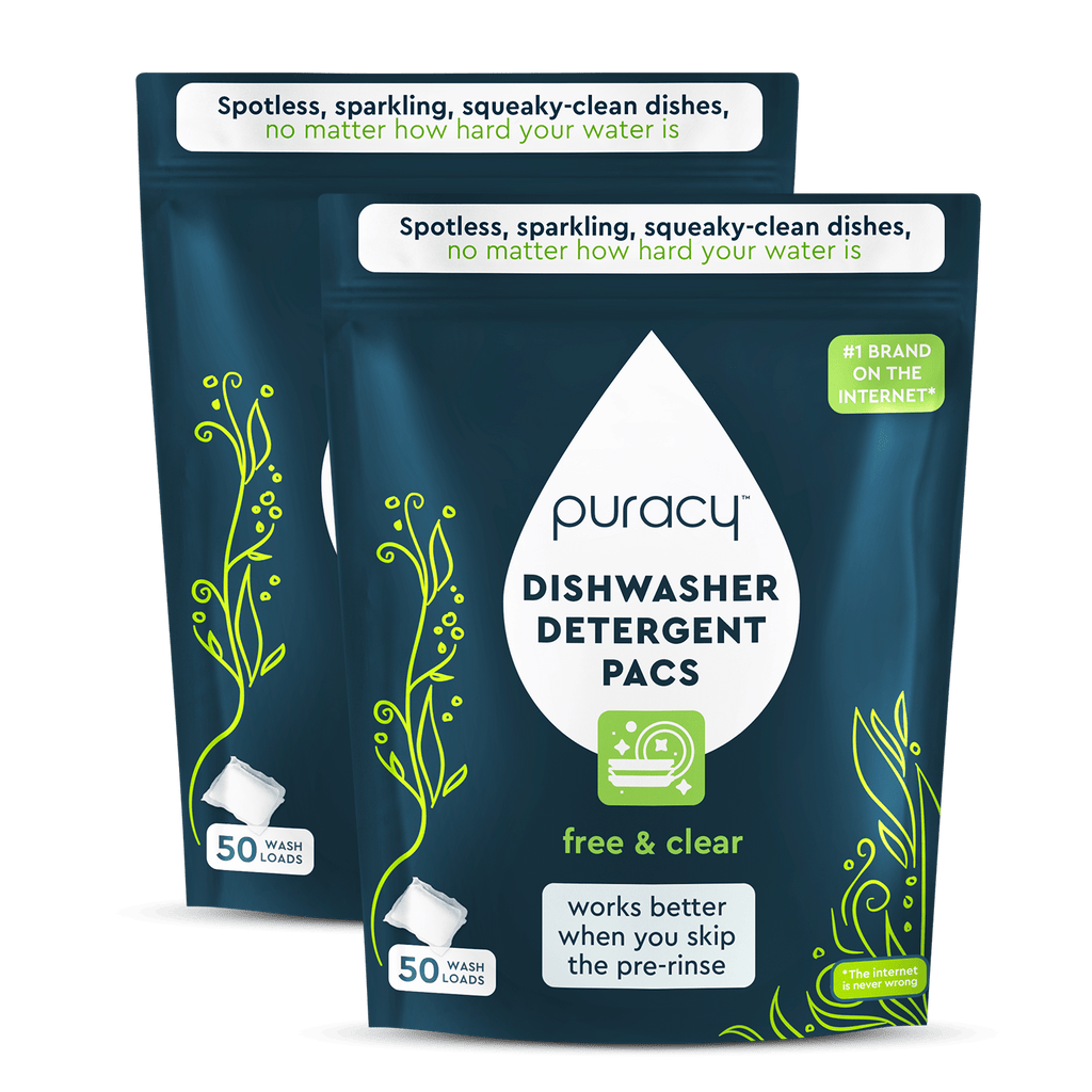 Two packages of puracy dishwasher detergent pacs on a green background