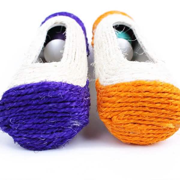 Two colorful cat toys with purple and orange bases on a white background
